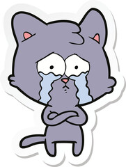 sticker of a cartoon crying cat