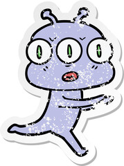 distressed sticker of a cartoon three eyed alien