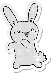 distressed sticker of a cartoon rabbit