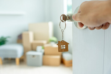 Moving house, relocation. The key was inserted into the door of the new house, inside the room was...