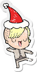 cute distressed sticker cartoon of a girl with hipster haircut wearing santa hat
