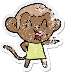 distressed sticker of a crazy cartoon monkey in dress pointing