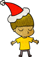 textured cartoon of a calm boy wearing santa hat