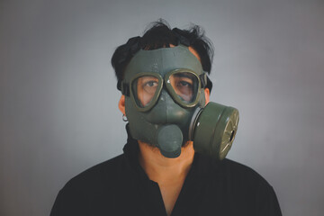 profile of young with gas mask. grunge portrait man in gas mask.