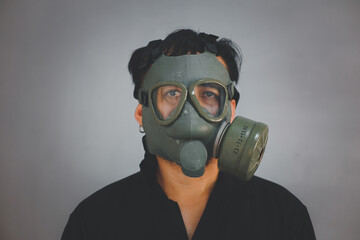 profile of young with gas mask. grunge portrait man in gas mask.