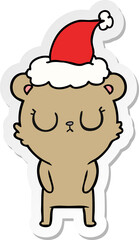peaceful sticker cartoon of a bear wearing santa hat