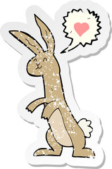 retro distressed sticker of a cartoon rabbit in love