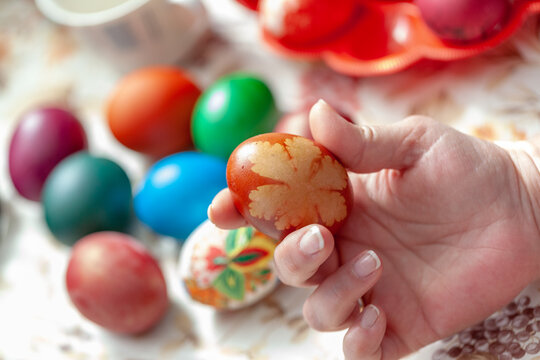 Mother and son play with decorative eggs on Easter day