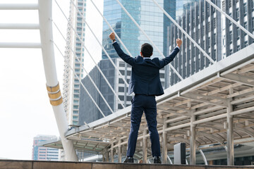 the businessman who raises his hands happily