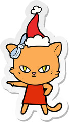 cute sticker cartoon of a cat wearing dress wearing santa hat