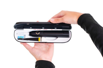 Hands Holding a Slick Case with an Electric Toothbrush