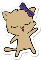 sticker of a cartoon cat with bow on head