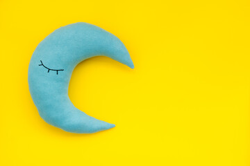Soft pillow in shape of moon. Bedding for good sleep and rest