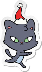 cute sticker cartoon of a cat wearing santa hat