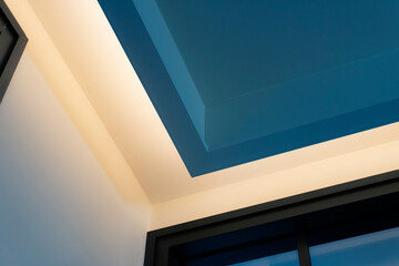 hidden LED lighting inside room ceiling. Cozy and luxury interior design. - obrazy, fototapety, plakaty