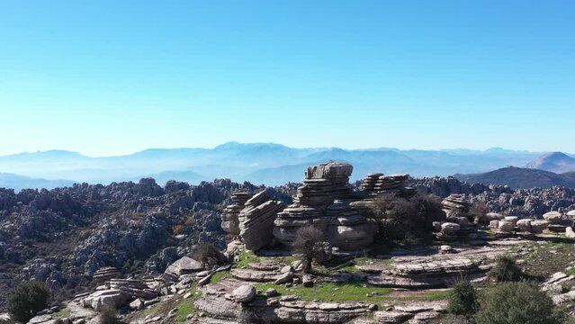 Impressive Mountain top rocks in Torcal de Antequera seen from above, aerial drone view of karstik rocks in Spain