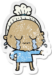 distressed sticker of a cartoon crying old lady