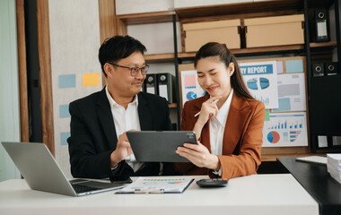 Portrait of success business people working together in home office. Couple teamwork startup concept