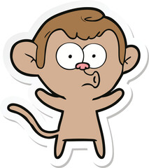 sticker of a cartoon surprised monkey
