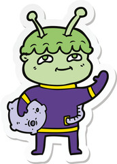 sticker of a friendly cartoon spaceman waving