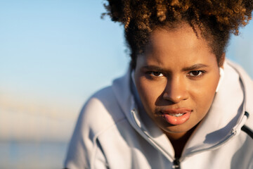 Portrait Of Motivated Young Black Female In Sportswear Posing Outdoors