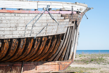 Old derelict wooden ship wreck closeup. Wooden ship ribs, planking, and decking.