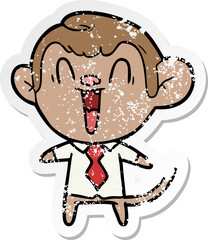 distressed sticker of a cartoon laughing monkey