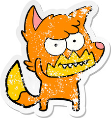 distressed sticker of a cartoon grinning fox