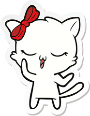 sticker of a cartoon cat with bow on head