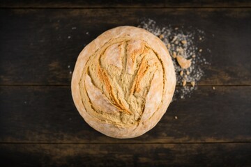 freshly baked rustic sourdough bread dusted with powdered sugar