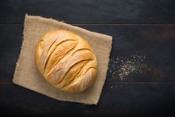 baked bread, freshly baked rustic sourdough bread dusted with powdered sugar