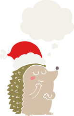 cartoon hedgehog wearing christmas hat and thought bubble in retro style