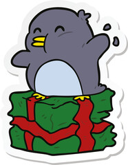 sticker of a cartoon penguin on present