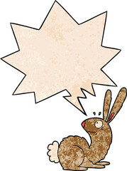 cartoon startled bunny rabbit and speech bubble in retro texture style
