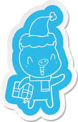 happy cartoon  sticker of a pig with xmas present wearing santa hat