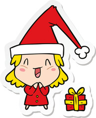 sticker of a cartoon girl wearing christmas hat