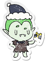 christmas distressed sticker cartoon of kawaii vampire