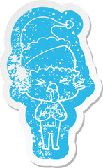 disgusted cartoon distressed sticker of a alien wearing santa hat