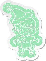 annoyed cartoon distressed sticker of a boy wearing santa hat