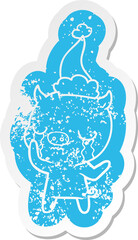 cartoon distressed sticker of a pig crying wearing santa hat