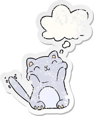 cartoon cat and thought bubble as a distressed worn sticker