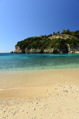 Fototapeta na wymiar Paleokastritsa beach, Corfu island, Greece- Beautiful beach in Spring.