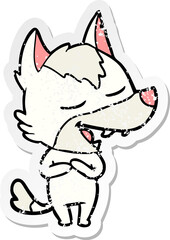 distressed sticker of a cartoon wolf laughing