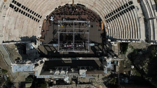 Drone shot revealing ancient roman amphitheater in the old town of Plovdiv city in Bulgaria - stock video