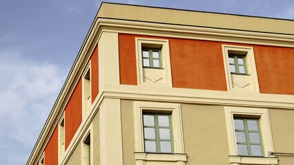 corner building facade with windows against the sky