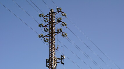 medium voltage metal tower against sky background