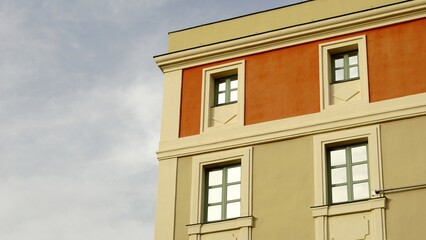 Fototapeta na wymiar classic building facade with windows against the sky
