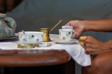 Coffee grounds reading. Fortune teller. Esoteric. Fortune telling. Woman reading fortune. cafeomancy
