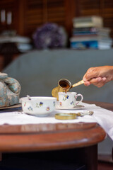 Coffee grounds reading. Fortune teller. Esoteric. Fortune telling. Woman reading fortune. cafeomancy