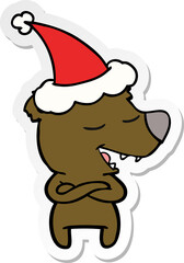 sticker cartoon of a bear wearing santa hat
